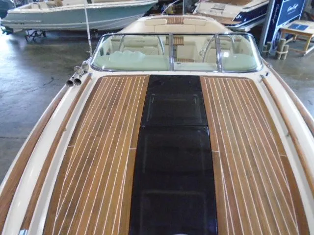 Slide: The Image of 2017 Chris-Craft Corsair 32 with sleek wood paneling. - 8