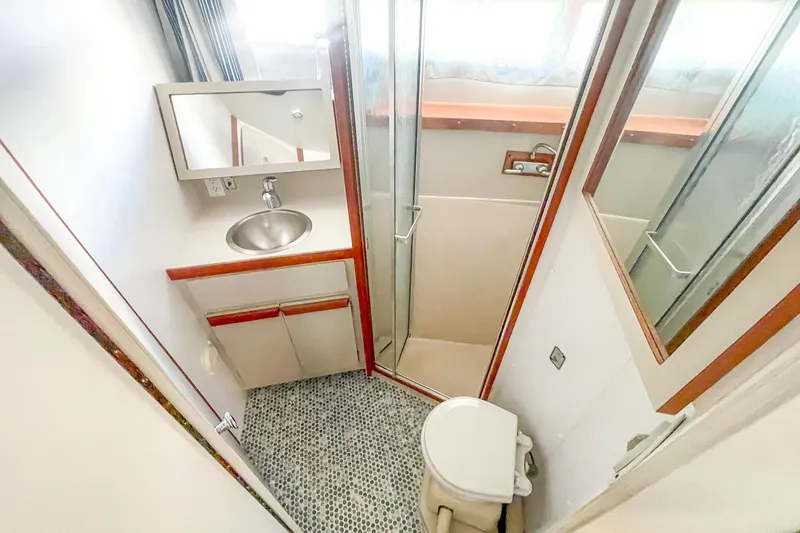 Slide: The Image of Bathroom interior of 1990 Carver 32 Montego yacht with shower and sink. - 33
