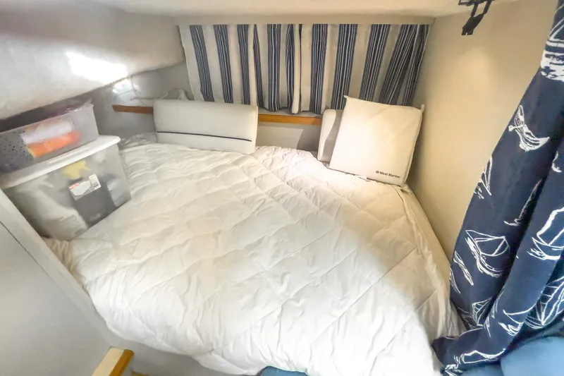 Slide: The Image of Cozy cabin interior of 1990 Carver 32 Montego with bed and nautical decor. - 38