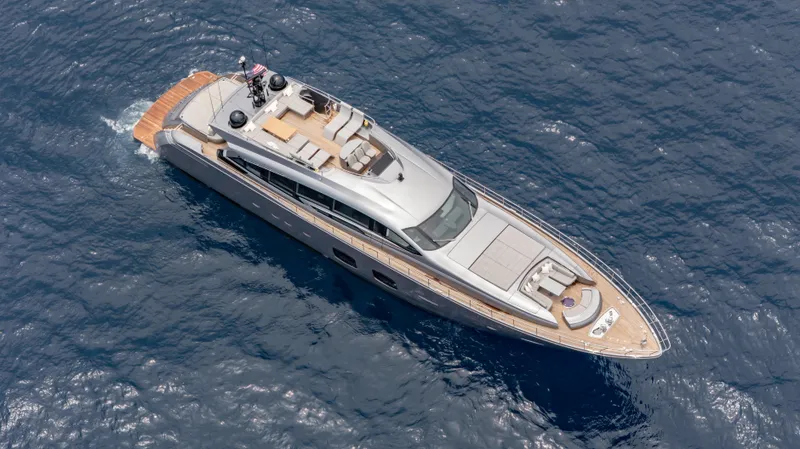 Slide: The Image of Aerial view of 2021 Pershing 108 yacht cruising on open sea. - 15