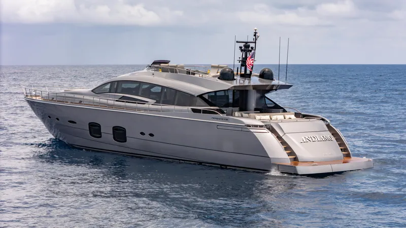 Slide: The Image of 2021 Pershing 108 yacht cruising on open sea under cloudy sky. - 17