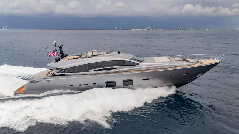 Slide: The Image of Luxury 2021 Pershing 108 yacht cruising on open sea with American flag. - 20