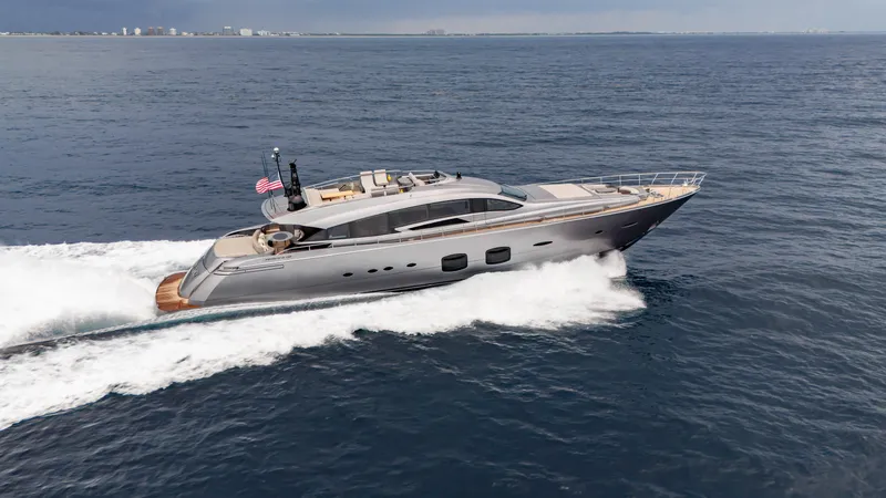 Slide: The Image of Luxury Pershing 108 yacht cruising on open sea, 2021 model, sleek design, American flag displayed. - 22