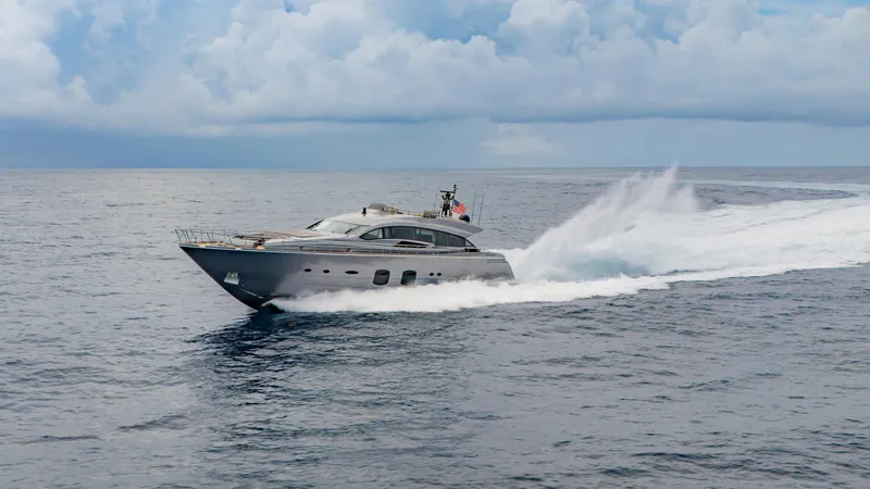 Slide: The Image of 2021 Pershing 108 yacht cruising on open sea under cloudy sky. - 25