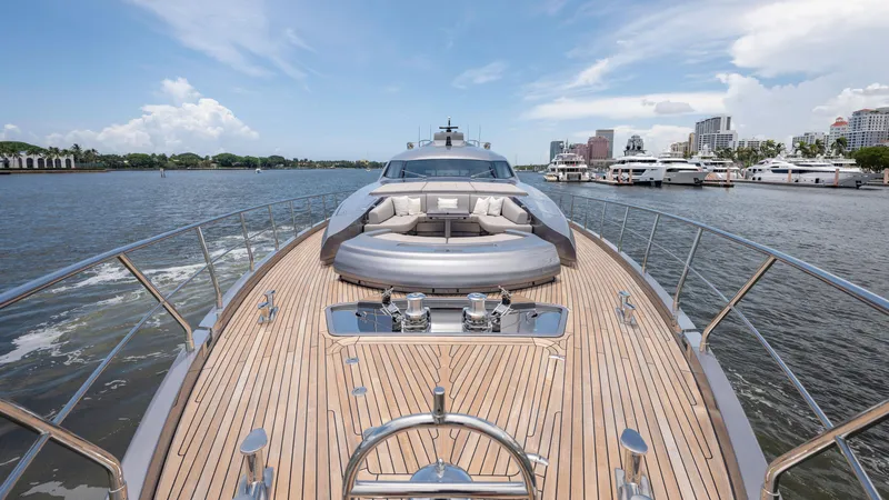 Slide: The Image of Luxurious 2021 Pershing 108 yacht with sleek deck design, cruising in a scenic marina. - 3