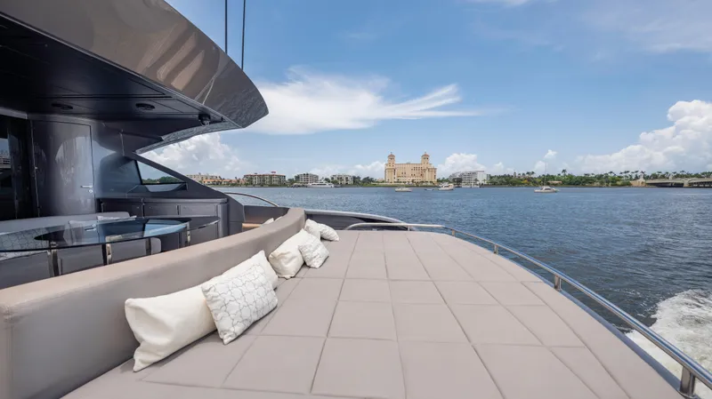 Slide: The Image of Luxurious 2021 Pershing 108 yacht with spacious deck, scenic waterfront view. - 34