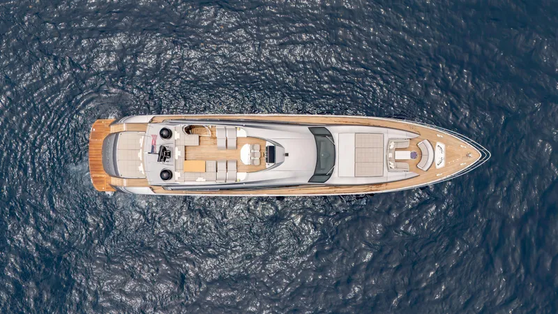 Slide: The Image of Top view of a 2021 Pershing 108 yacht on open water. - 4