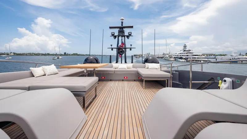Slide: The Image of Luxurious 2021 Pershing 108 yacht deck with modern seating and scenic ocean view. - 42