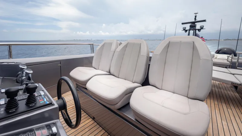 Slide: The Image of Luxury seating on 2021 Pershing 108 yacht, featuring sleek design and ocean view. - 47