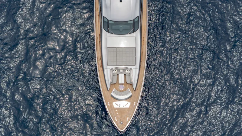 Slide: The Image of Aerial view of 2021 Pershing 108 yacht cruising on the ocean. - 7
