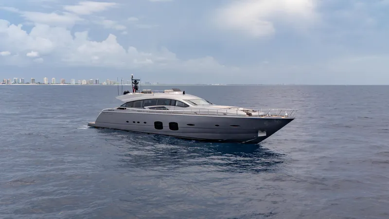 Slide: The Image of Luxury Pershing 108 yacht cruising on open sea, 2021 model, with city skyline in background. - 8