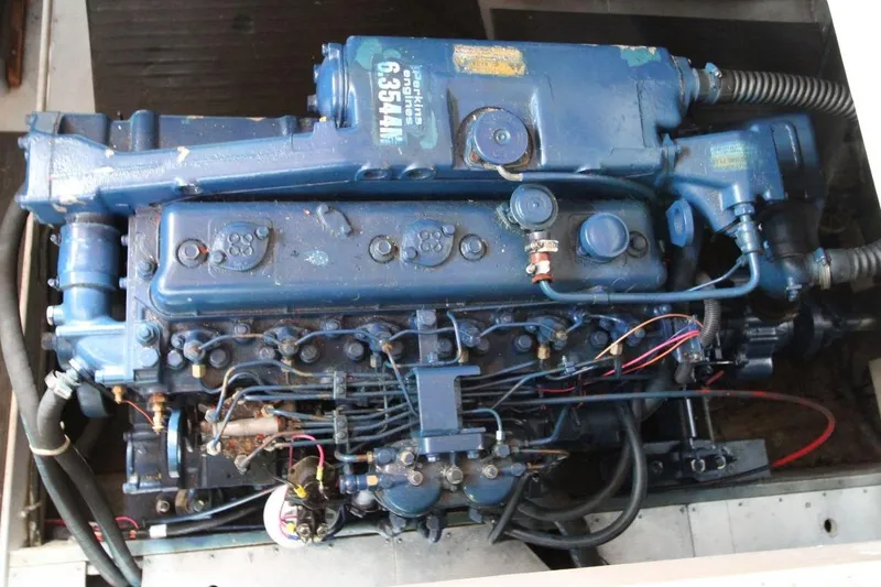 Slide: The Image of Engine of a 1986 DeFever 41 Trawler, showcasing detailed mechanical components. - 29