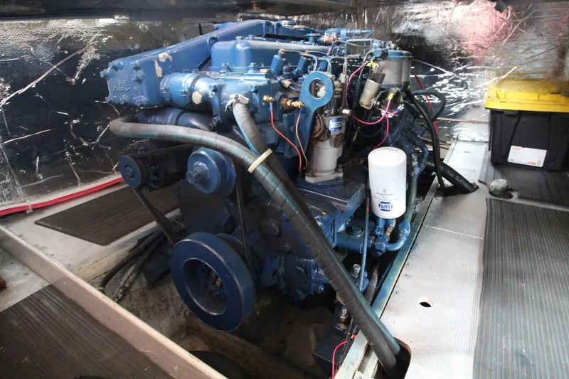 Slide: The Image of Engine room of a 1986 DeFever 41 Trawler with visible machinery and components. - 30