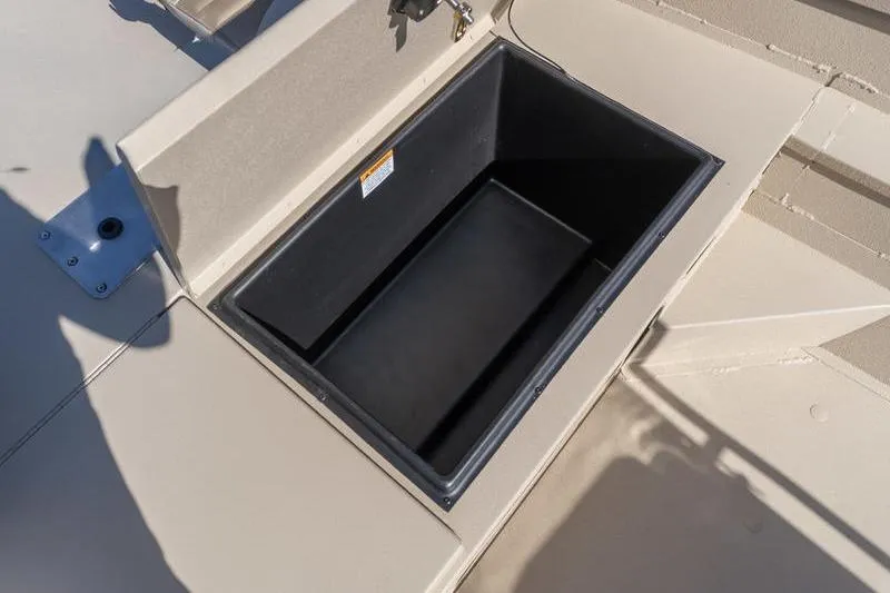 Slide: The Image of Storage compartment on 2026 G3 Bay 20 boat, open and empty. - 12