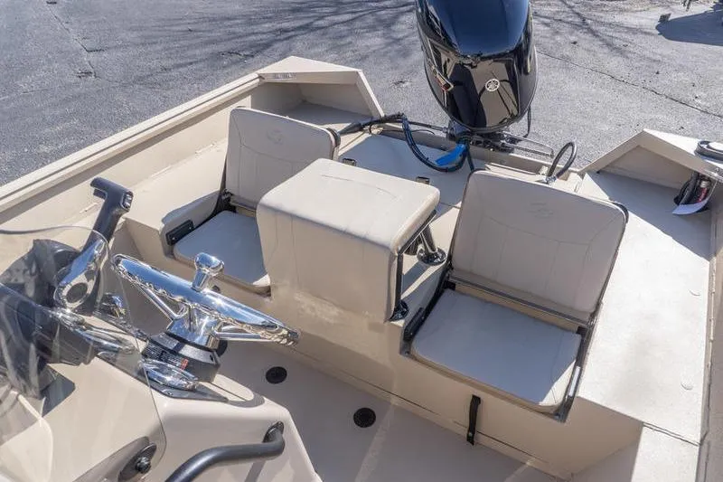 Slide: The Image of 2026 G3 Bay 20 boat interior with seating and steering wheel. - 14