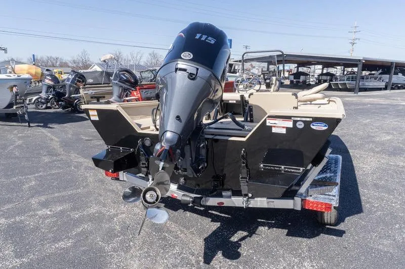 Slide: The Image of 2026 G3 Bay 20 boat with powerful outboard motor on a trailer in a parking lot. - 3