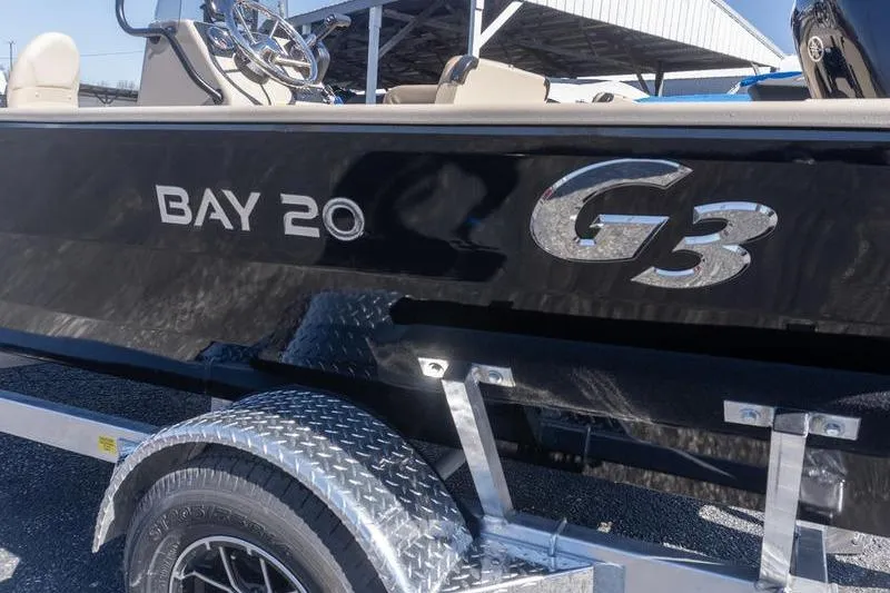 Slide: The Image of 2026 G3 Bay 20 boat on trailer, featuring sleek black design and chrome accents. - 4