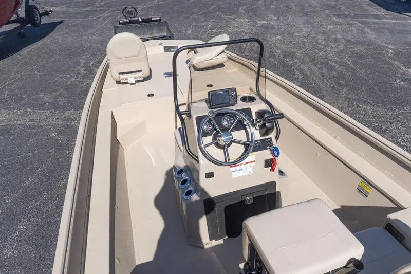 Slide: The Image of 2026 G3 Bay 20 boat interior with steering console and seating. - 5