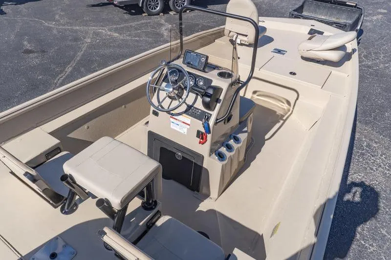 Slide: The Image of 2026 G3 Bay 20 boat interior with steering console and seating. - 6