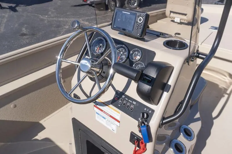 Slide: The Image of Steering console of 2026 G3 Bay 20 boat with gauges and navigation system. - 7