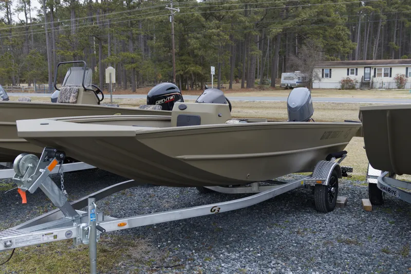 Slide: The Image of 2026 G3 Gator Tough 17 SC boat on trailer, parked outdoors. - 5