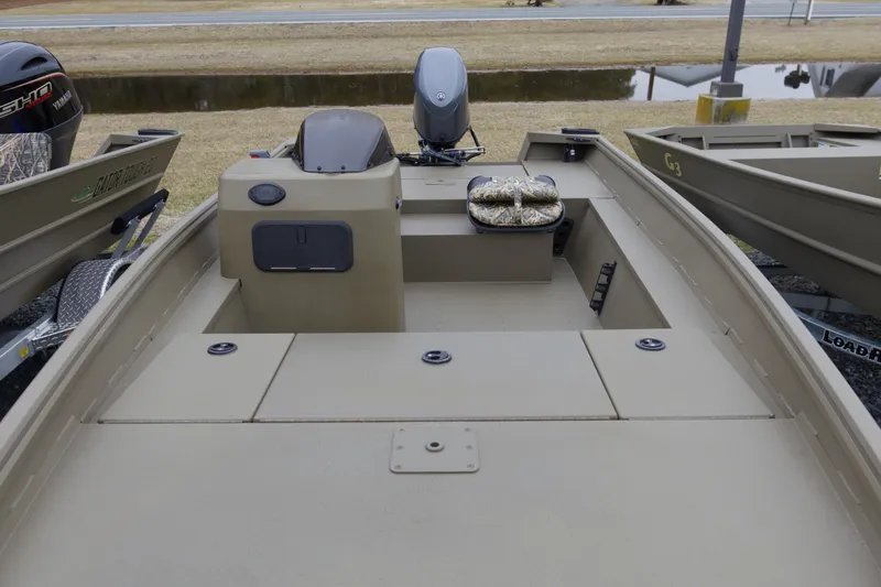 Slide: The Image of 2026 G3 Gator Tough 17 SC boat interior with motor and seating. - 6