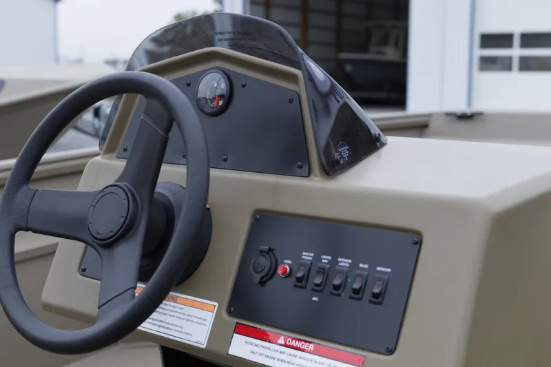 Slide: The Image of Steering console of 2026 G3 Gator Tough 17 SC boat with control panel. - 9