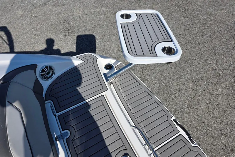 Slide: The Image of 2017 Yamaha Boats 212 Limited swim platform with table and cup holders. - 13