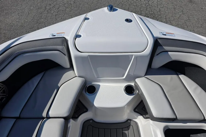 Slide: The Image of 2017 Yamaha Boats 212 Limited interior with cushioned seating and cup holders. - 21