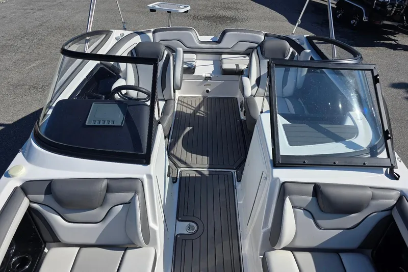 Slide: The Image of 2017 Yamaha Boats 212 Limited interior with sleek seating and modern dashboard design. - 23