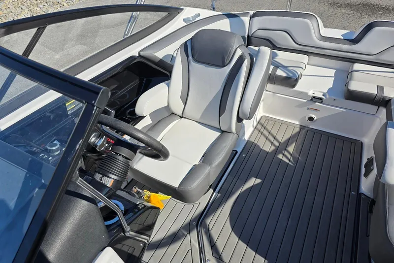 Slide: The Image of 2017 Yamaha Boats 212 Limited interior with steering wheel and seating. - 24