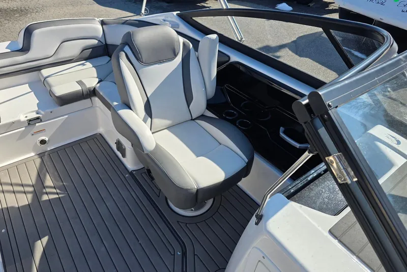 Slide: The Image of 2017 Yamaha Boats 212 Limited interior with gray seating and sleek design. - 25