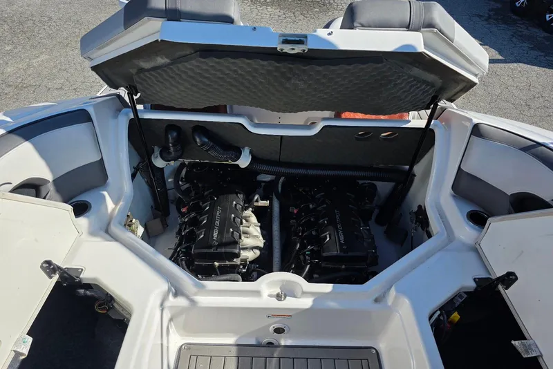 Slide: The Image of Open engine compartment of a 2017 Yamaha Boats 212 Limited, showcasing dual engines. - 32