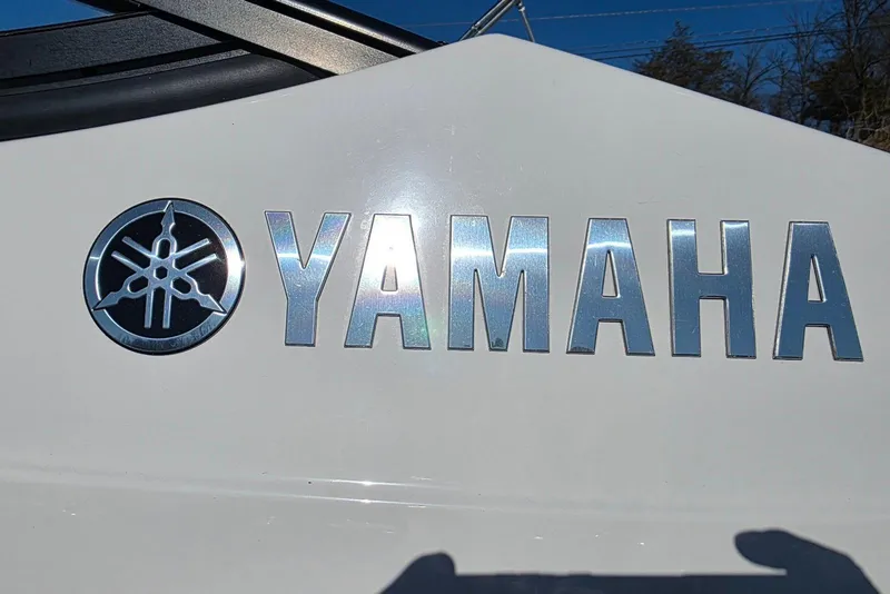 Slide: The Image of Yamaha Boats 2017 212 Limited logo on white surface under clear blue sky. - 7