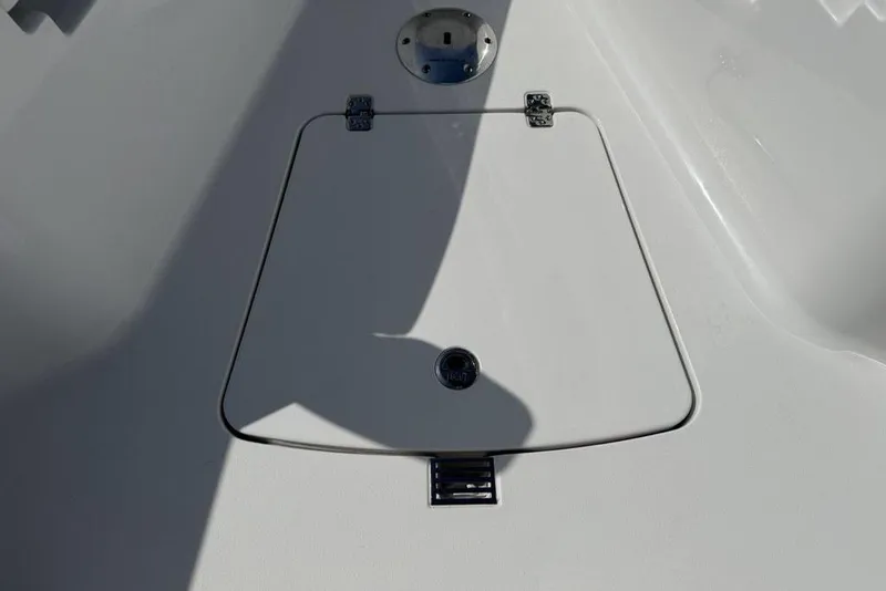 Slide: The Image of 2026 Sportsman Open 252 Center Console deck hatch, featuring sleek design and durable hinges. - 10