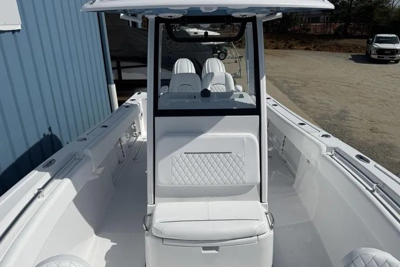 Slide: The Image of 2026 Sportsman Open 252 Center Console boat with sleek white interior design. - 15