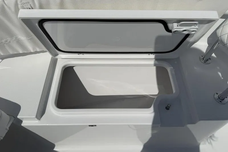 Slide: The Image of Open storage compartment on 2026 Sportsman Open 252 Center Console boat. - 16