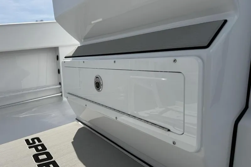 Slide: The Image of 2026 Sportsman Open 252 Center Console boat interior detail, featuring sleek storage compartment. - 18