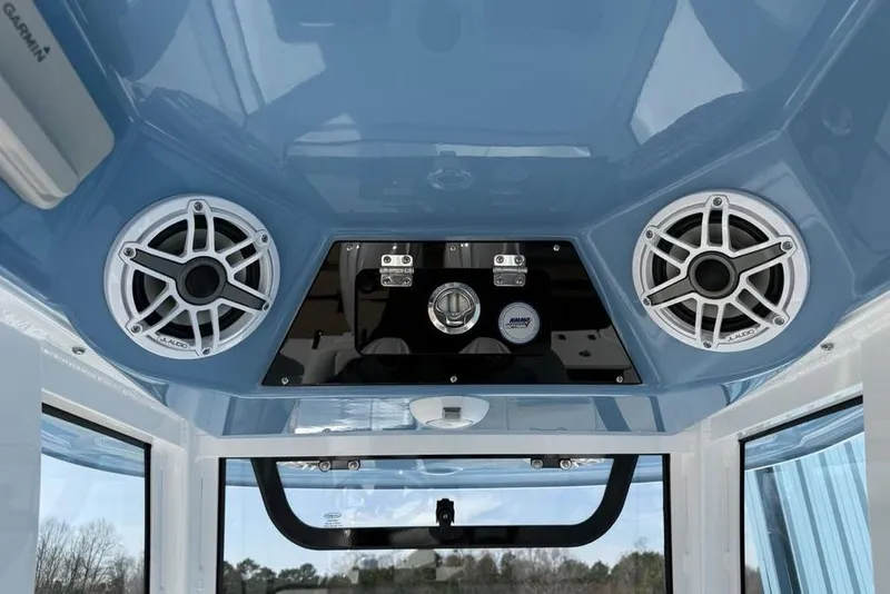 Slide: The Image of 2026 Sportsman Open 252 Center Console boat interior with speakers and control panel. - 20