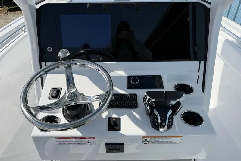 Slide: The Image of 2026 Sportsman Open 252 Center Console dashboard with steering wheel and controls. - 21