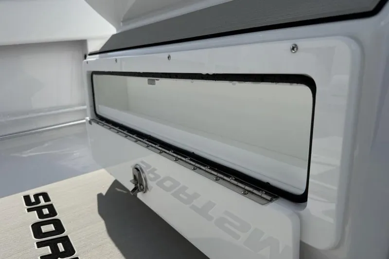 Slide: The Image of 2026 Sportsman Open 252 Center Console boat storage compartment detail. - 25