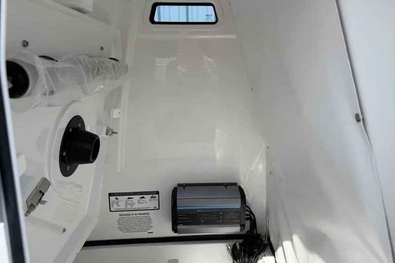 Slide: The Image of Interior of 2026 Sportsman Open 252 Center Console boat, featuring equipment and wiring. - 27