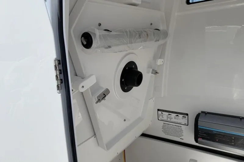 Slide: The Image of Interior view of 2026 Sportsman Open 252 Center Console boat, featuring storage compartment. - 29