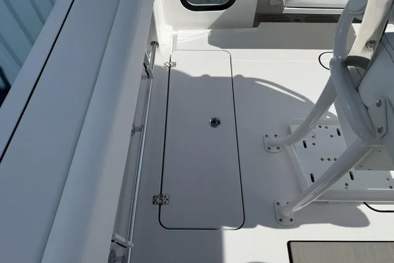 Slide: The Image of 2026 Sportsman Open 252 Center Console boat interior, featuring sleek white deck design. - 30