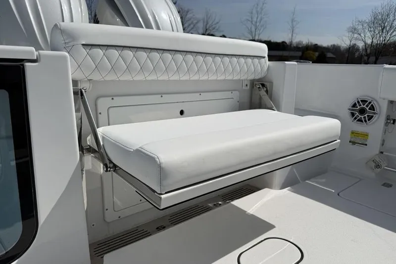 Slide: The Image of 2026 Sportsman Open 252 Center Console boat with white cushioned seating. - 32