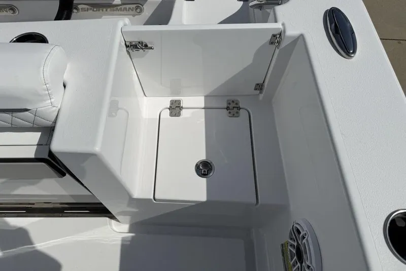Slide: The Image of 2026 Sportsman Open 252 Center Console boat interior with storage compartment and seating. - 34
