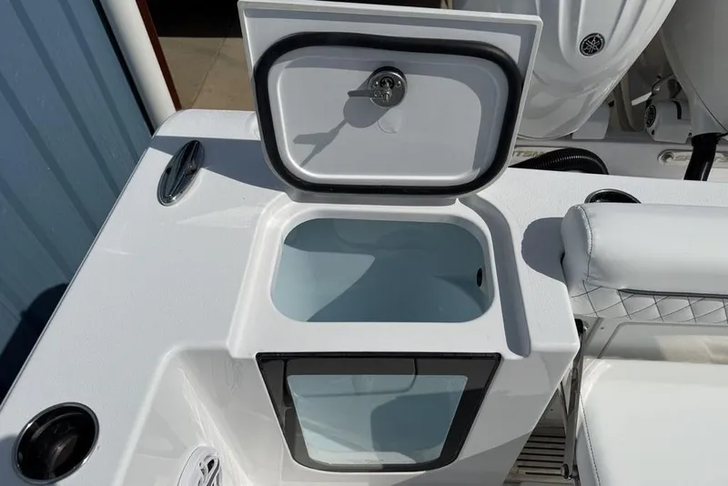 Slide: The Image of 2026 Sportsman Open 252 Center Console boat with open storage compartment. - 36