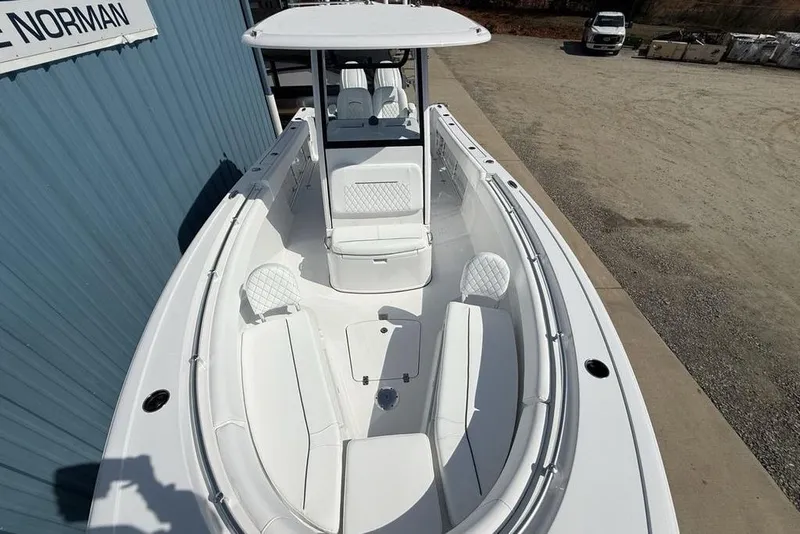 Slide: The Image of 2026 Sportsman Open 252 Center Console boat with sleek white seating and modern design. - 39