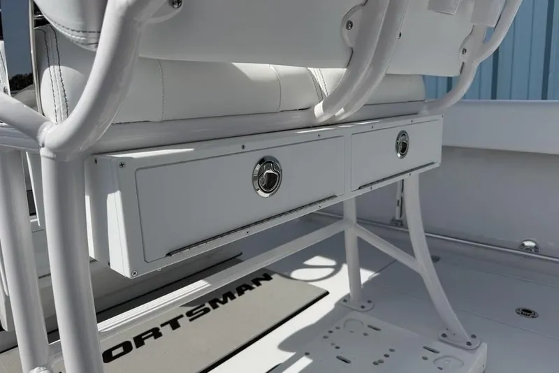 Slide: The Image of 2026 Sportsman Open 252 Center Console boat interior with storage drawers and seating. - 41