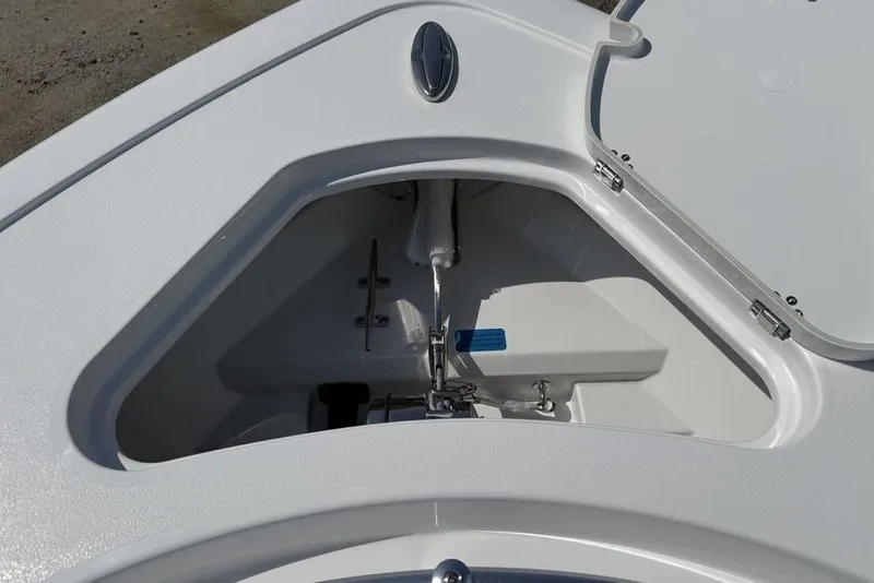 Slide: The Image of 2026 Sportsman Open 252 Center Console anchor storage compartment, open lid view. - 5